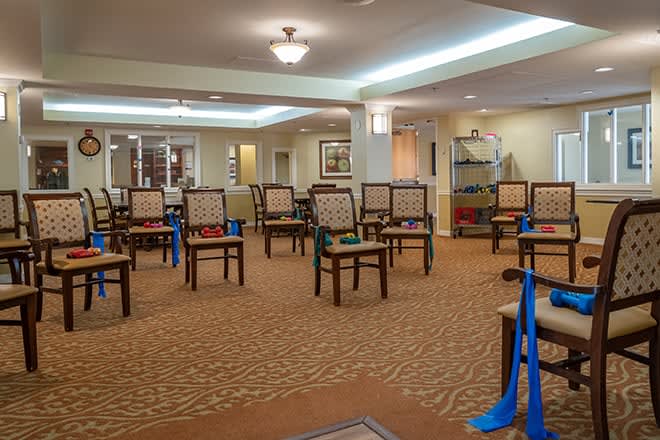 An empty meeting room arranged with chairs, ready for a conference or gathering.