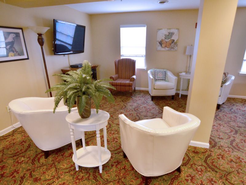 Cozy living room with comfortable seating and a television.