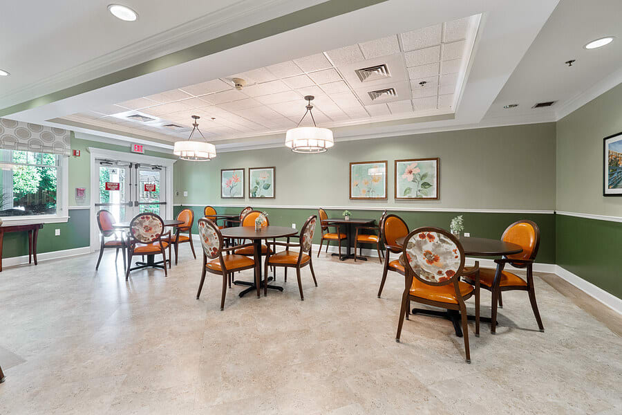 An empty dining area with elegant decor and lighting.