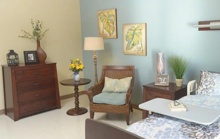 A cozy living room with vintage furniture and soft pastel decor.