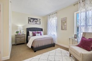 A cozy bedroom with elegant decor and comfortable furnishings.