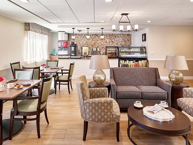 A cozy caf interior with comfortable seating and a welcoming atmosphere.