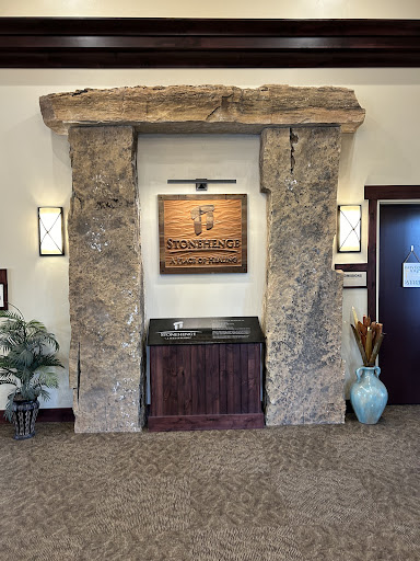 An inviting lobby area featuring a unique stone arch and modern decor.