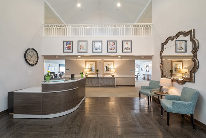 A modern and spacious reception area featuring stylish furniture and elegant decor.