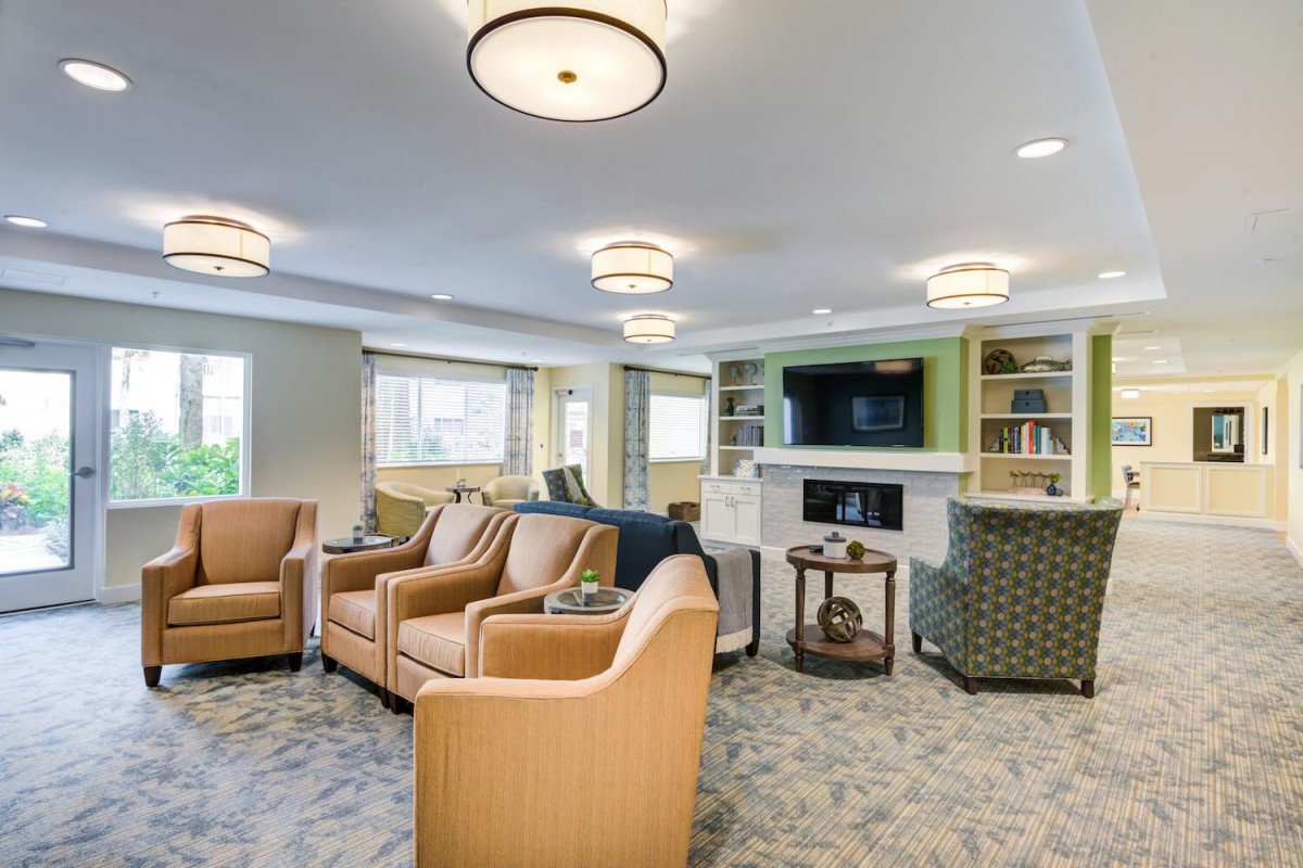 Spacious and inviting living room with modern furnishings and elegant lighting.
