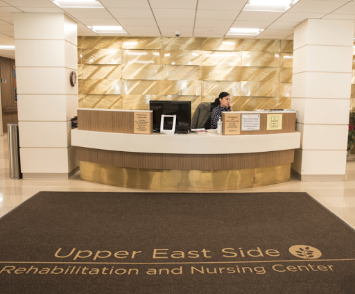 The reception area of Upper East Side Rehabilitation and Nursing Center, showcasing a modern design.