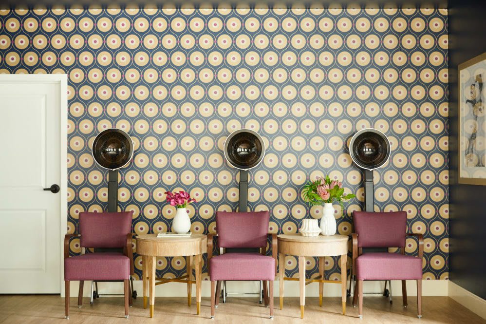 Vintage salon with retro hair dryers and chic decor.