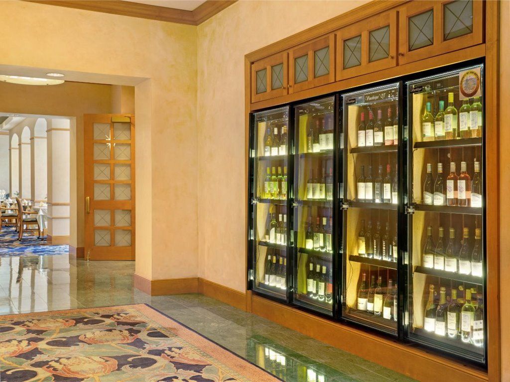 A well-organized wine cellar with bottles displayed on shelves.