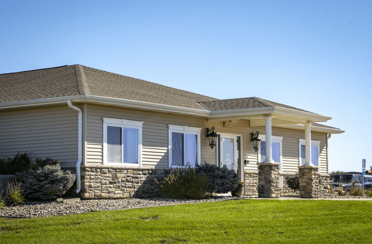 A single-story suburban house with a well-maintained lawn.