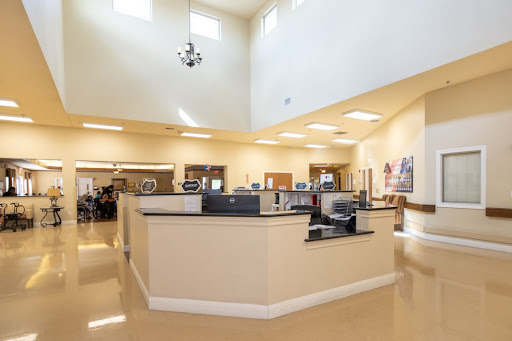 A spacious and well-lit reception area with modern furnishings.