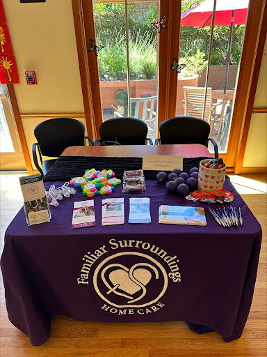 Promotional table for Familiar Surroundings Homecare at a community event.