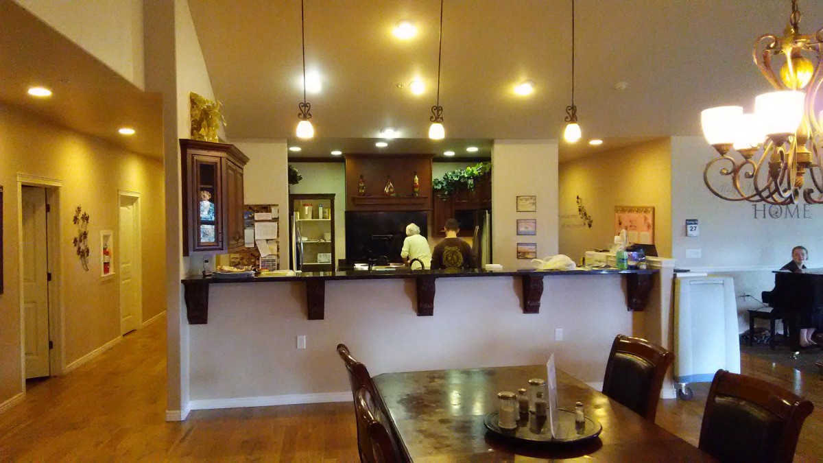 Cozy restaurant interior with a view of the dining area and counter.