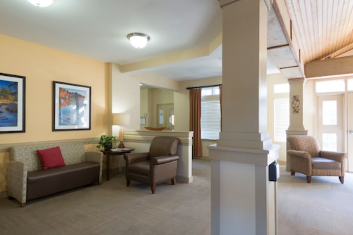 A cozy living room with comfortable seating and warm lighting.