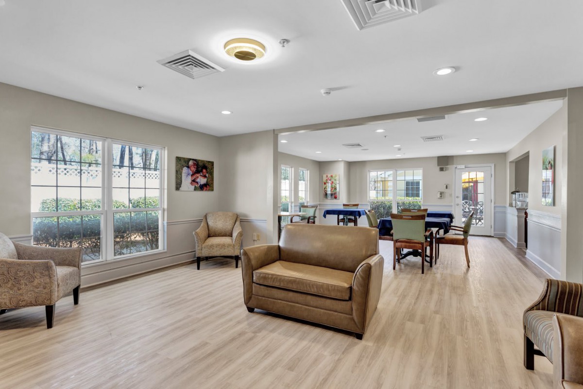 A modern living space with comfortable seating and ample natural light.