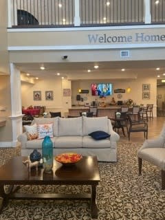 A welcoming living room area with a sofa, TV, and decorative elements.