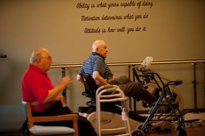 Seniors engaging in physical activity at a rehabilitation center, promoting health and wellness.