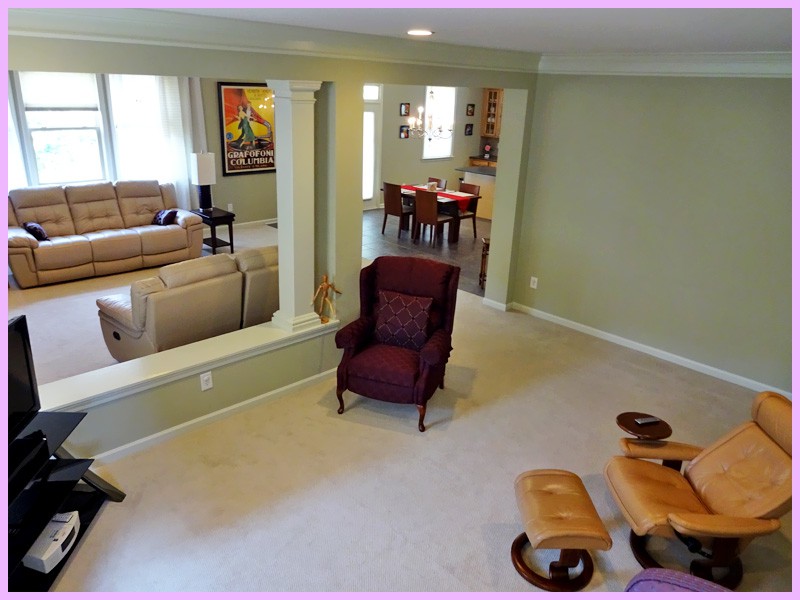 A spacious living area with comfortable seating and modern decor.