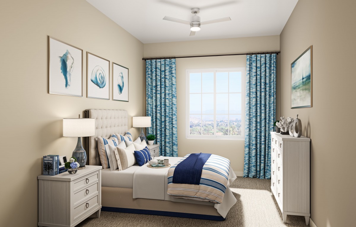 A modern bedroom featuring blue accents, stylish wall art, and coordinated decor.