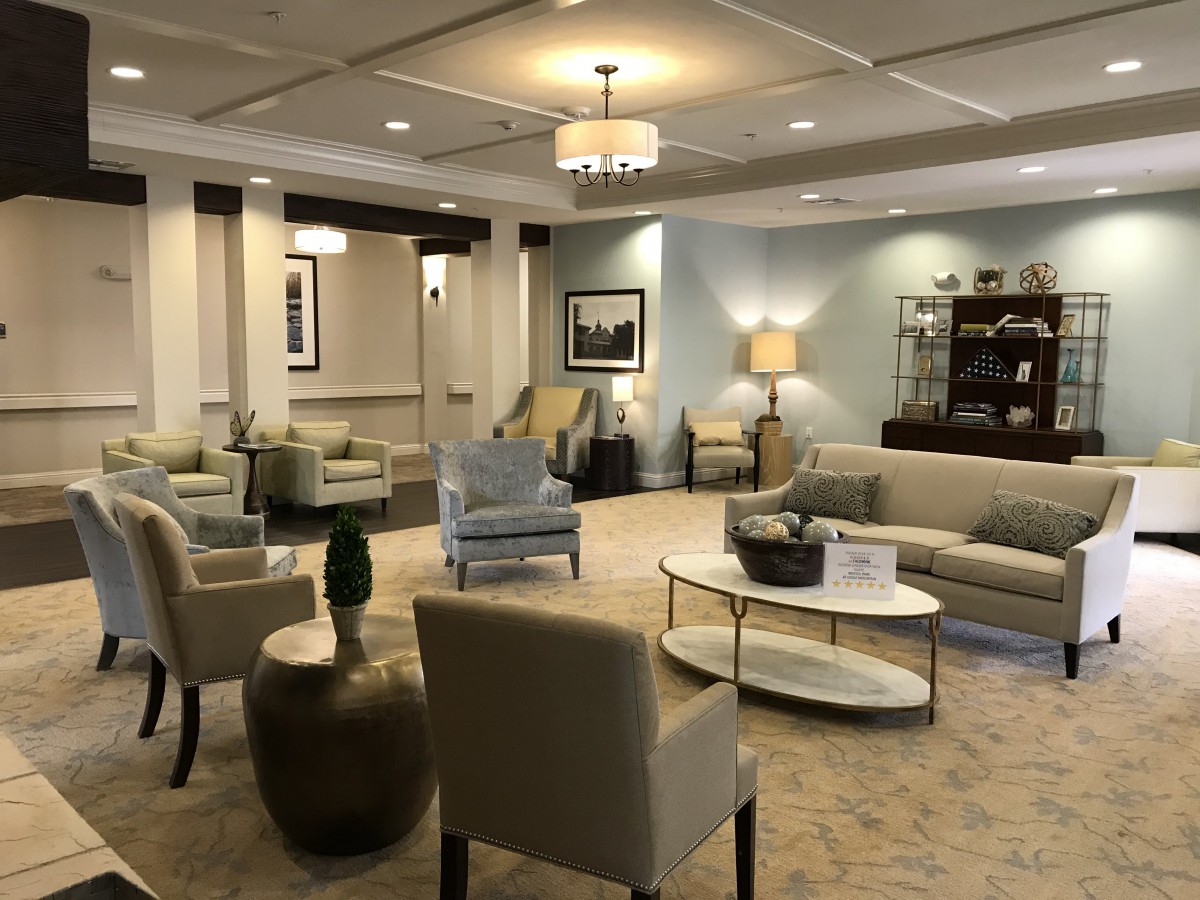 A well-furnished lobby with comfortable seating and elegant decor.