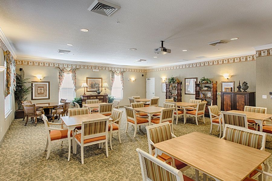 Spacious dining area with neatly arranged tables and chairs.