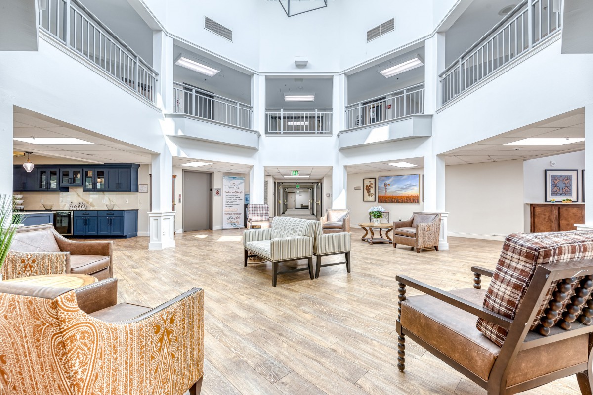 A bright and spacious lobby area with modern furniture and ample seating.