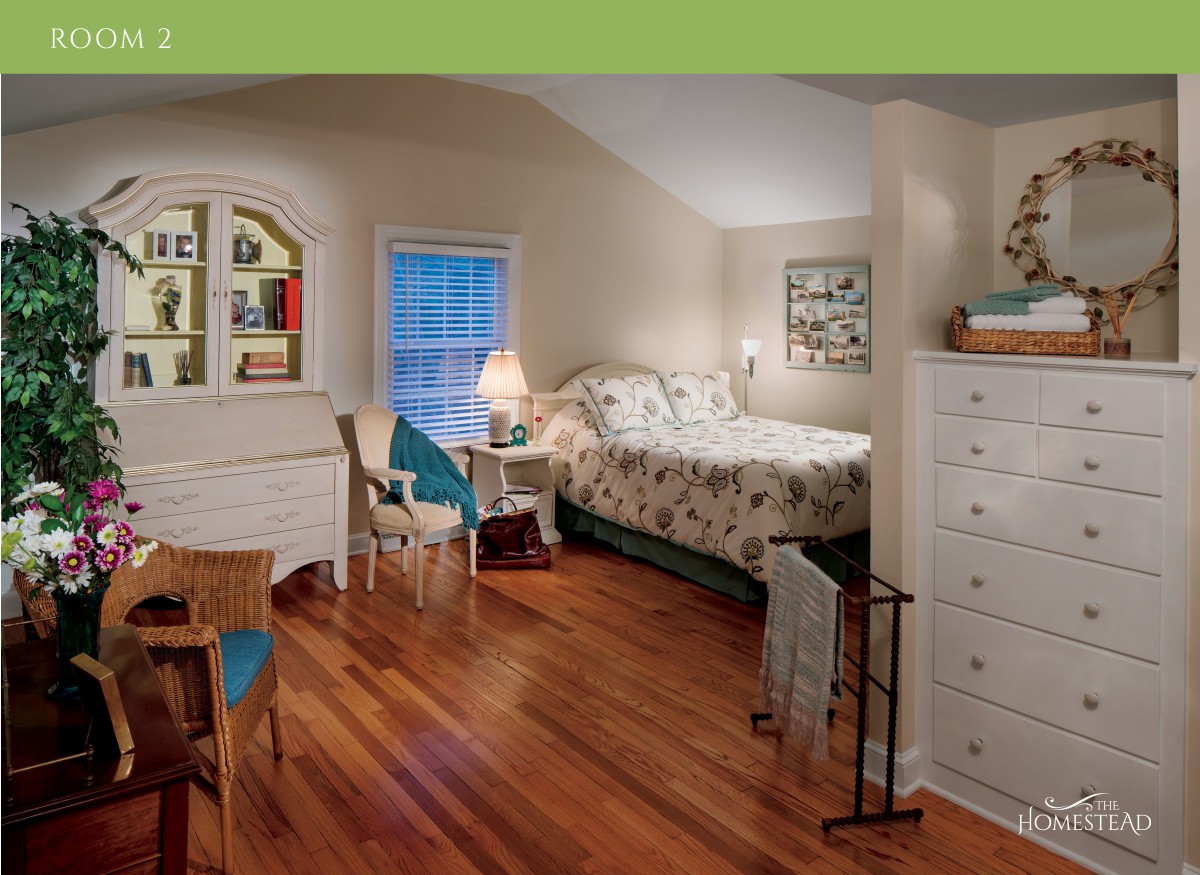 A cozy bedroom with a comfortable bed, wooden flooring, and classic furniture.