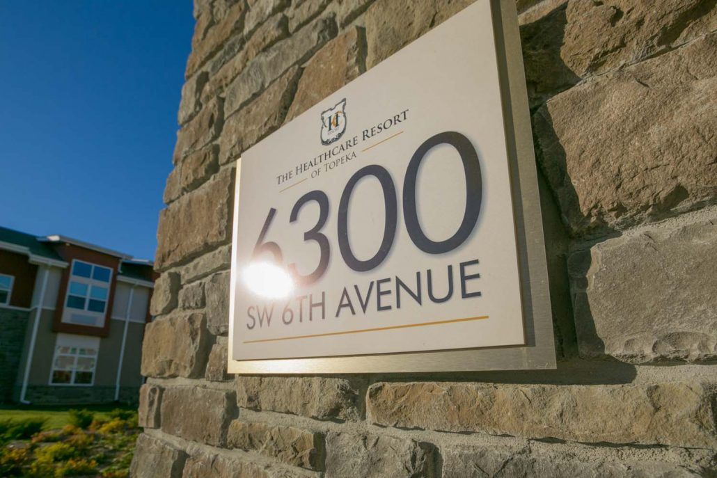 A building signage displaying the address 6300 9th Avenue.