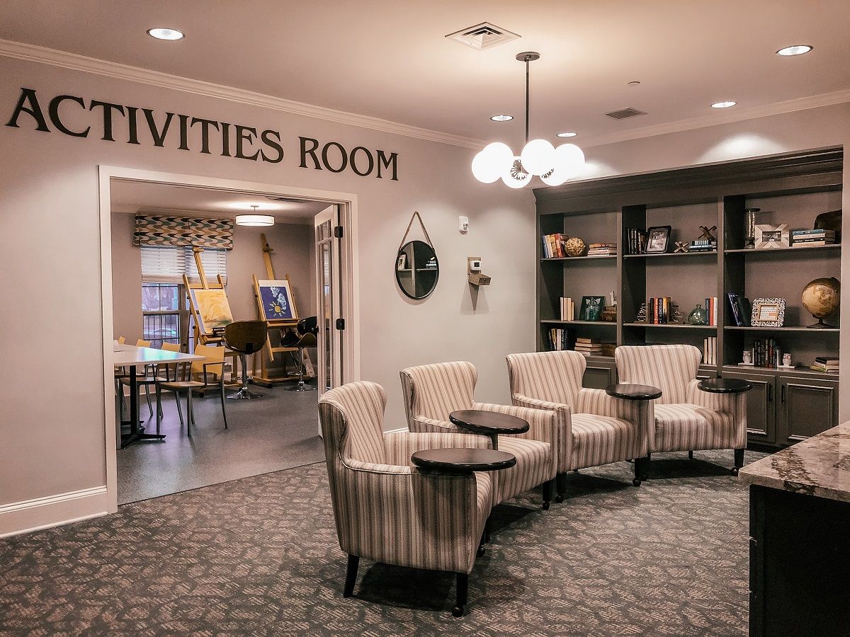A cozy activities room with comfortable chairs and a stylish decor.