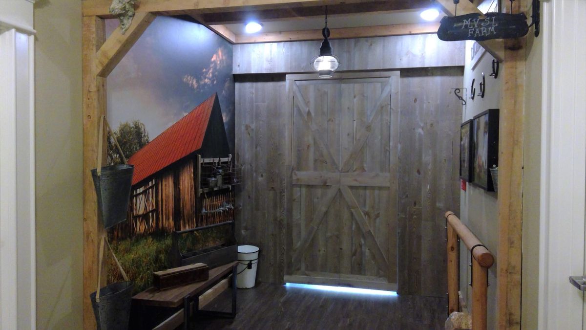 A rustic wooden door with barn-style decor and ambient lighting.