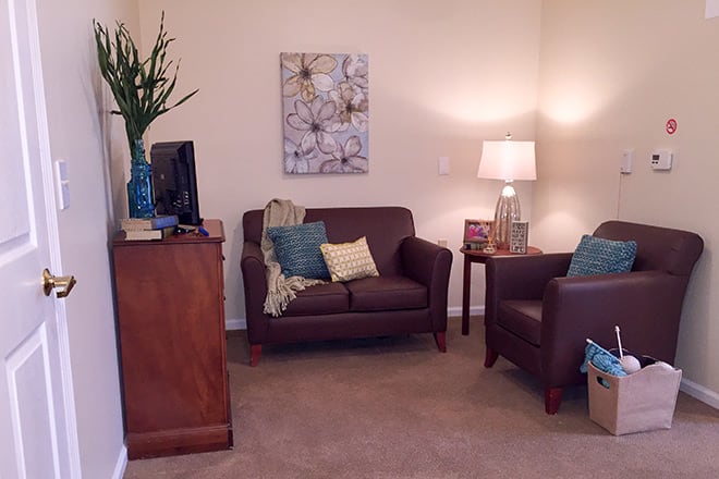 Cozy living room with comfortable seating and warm lighting.