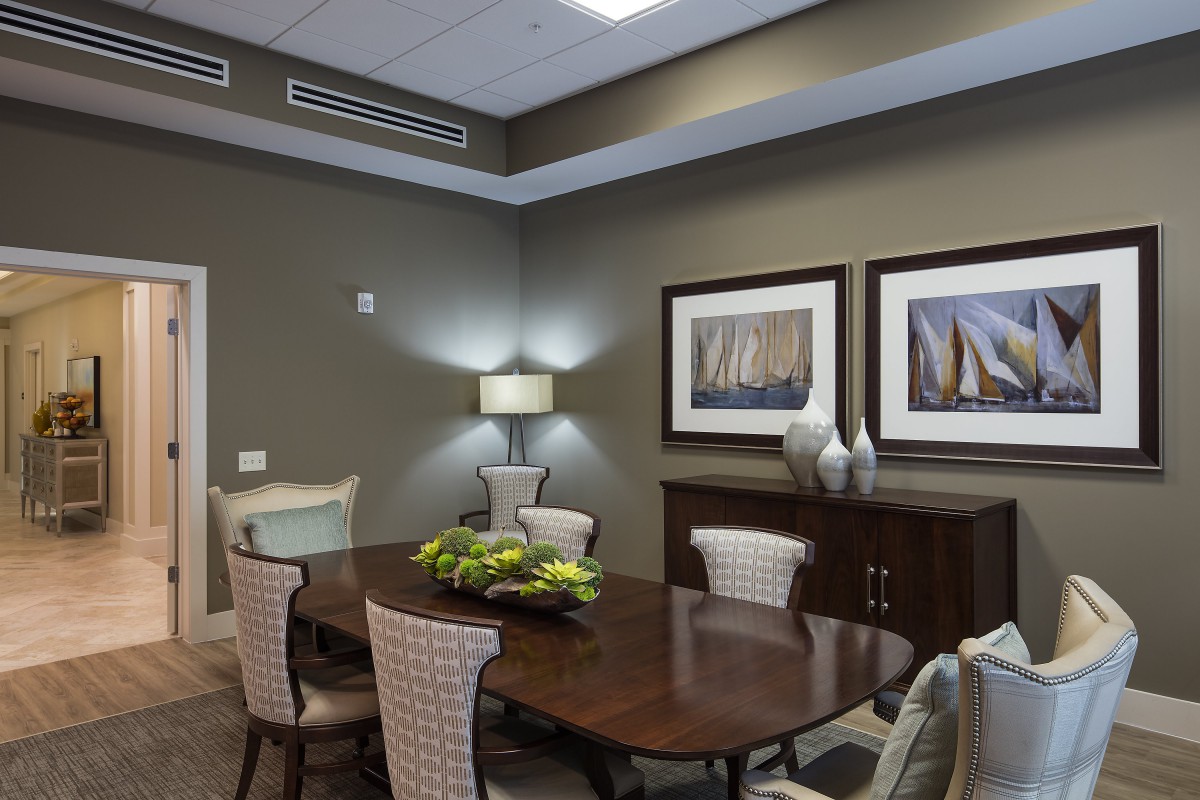A modern dining room with elegant furniture and tasteful decorations.