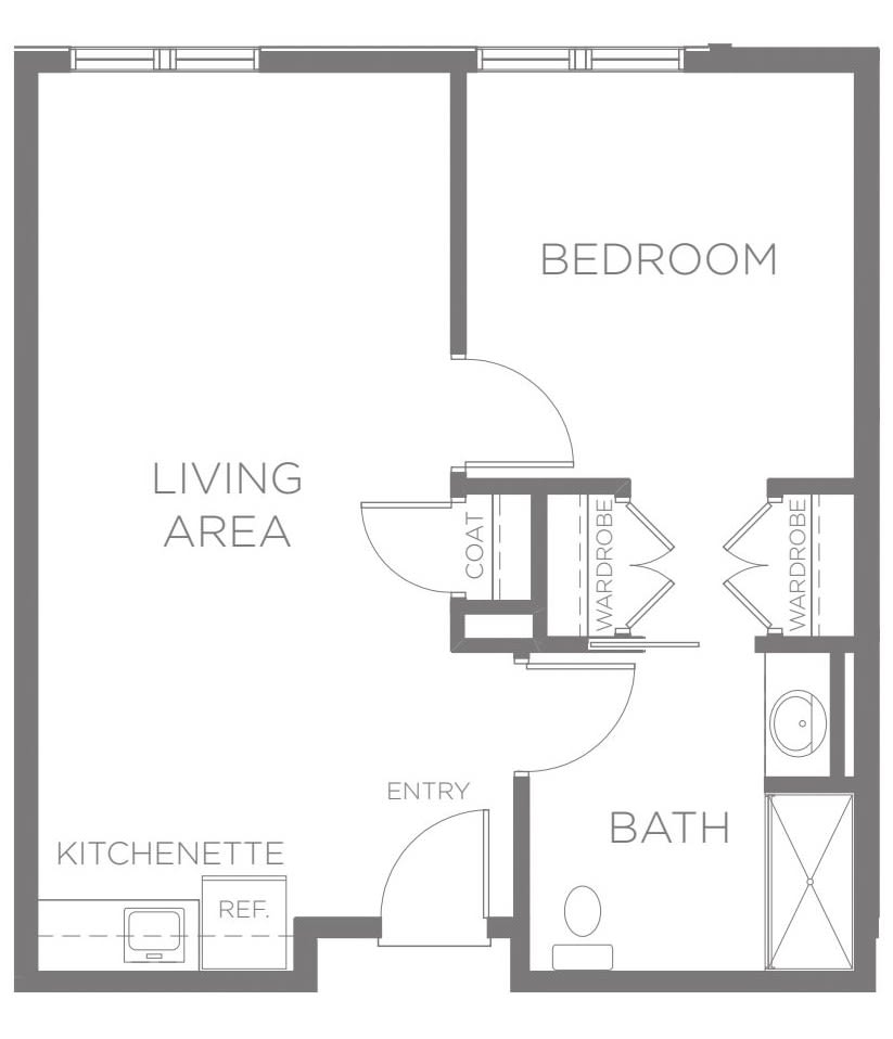 A floor plan showcasing a one-bedroom apartment with a living area, kitchenette, and bathroom.