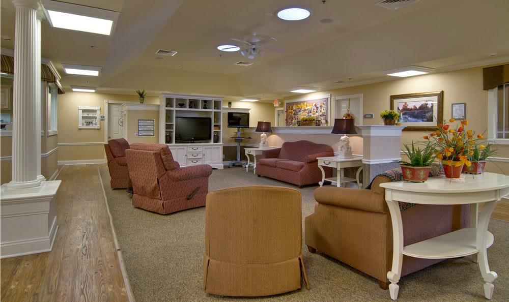 A cozy living room with comfortable seating and warm lighting.