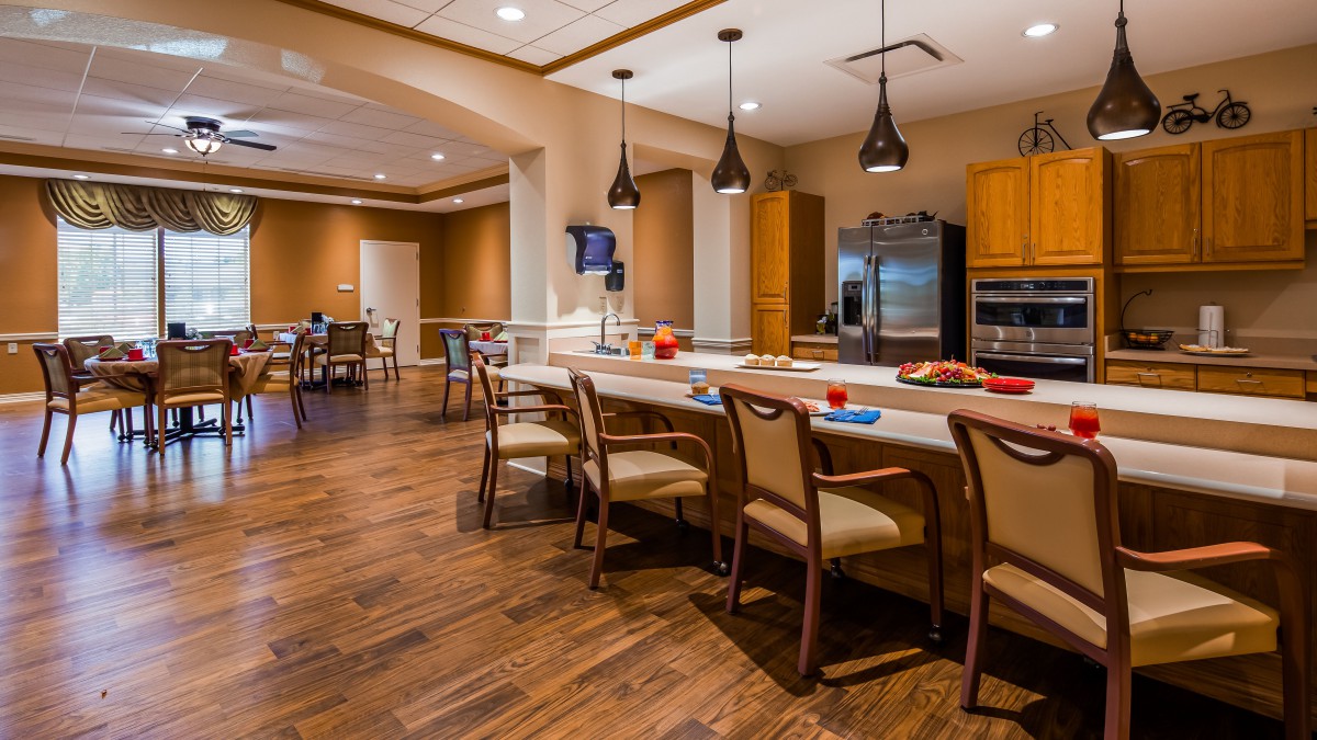 A spacious and modern kitchen with a large island and seating area.