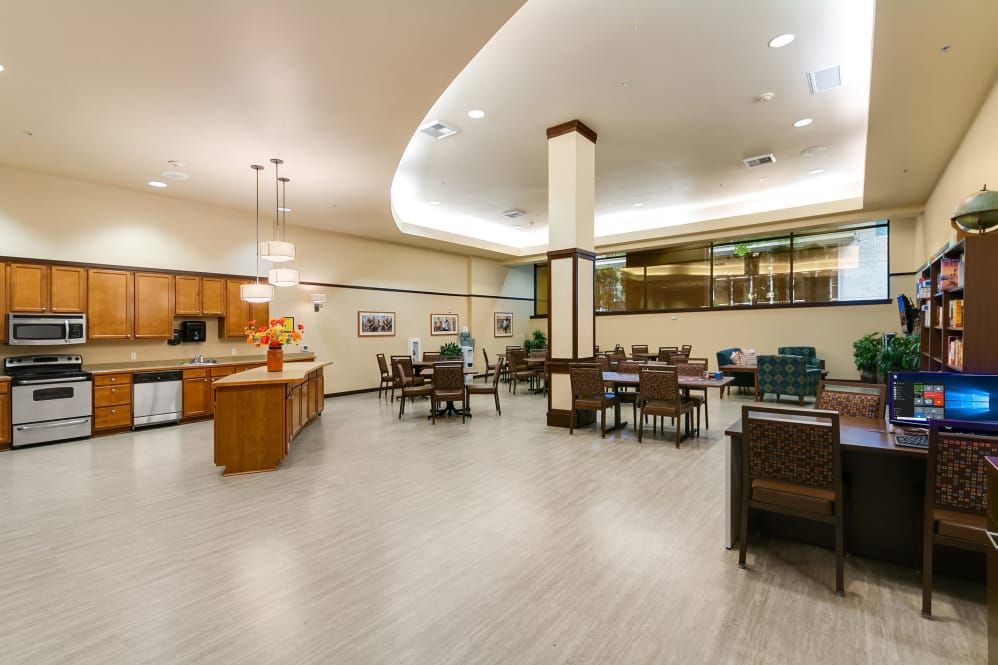 A spacious and modern lounge area with ample seating and contemporary lighting.
