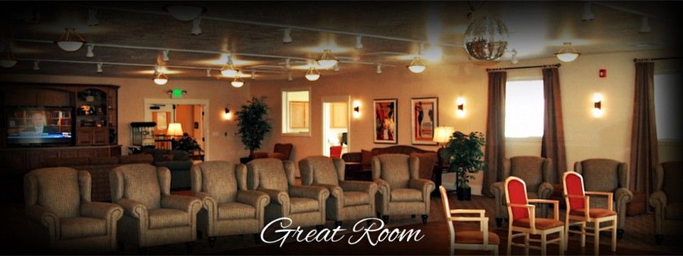 A cozy lounge area with comfortable seating and warm lighting.