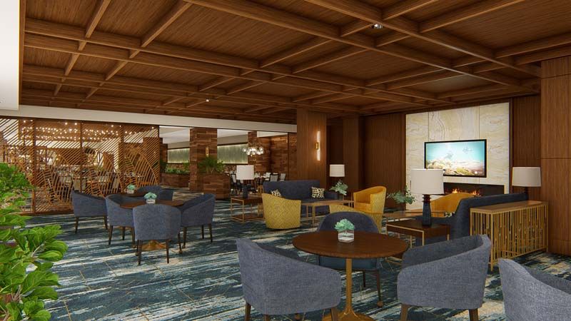 A modern lounge area with a variety of seating options, featuring wooden ceilings and a stylish carpet.