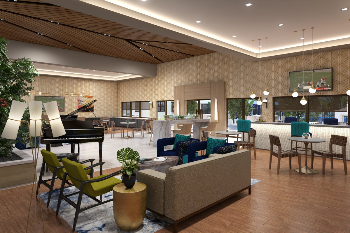 A modern hotel lobby with stylish seating, a grand piano, and a contemporary bar.