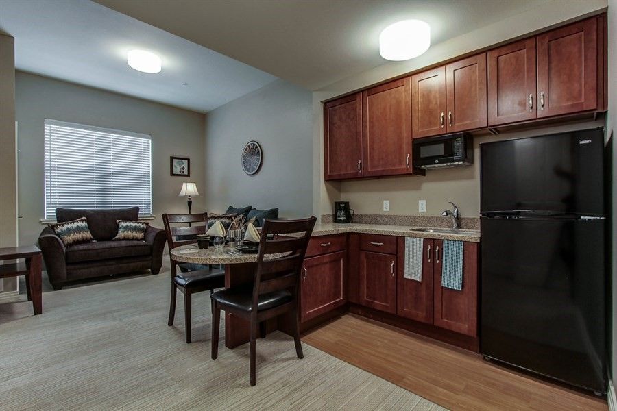 A cozy apartment kitchen and dining area with modern furnishings.
