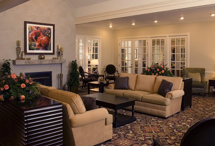 A cozy living room with comfortable seating and elegant decor.