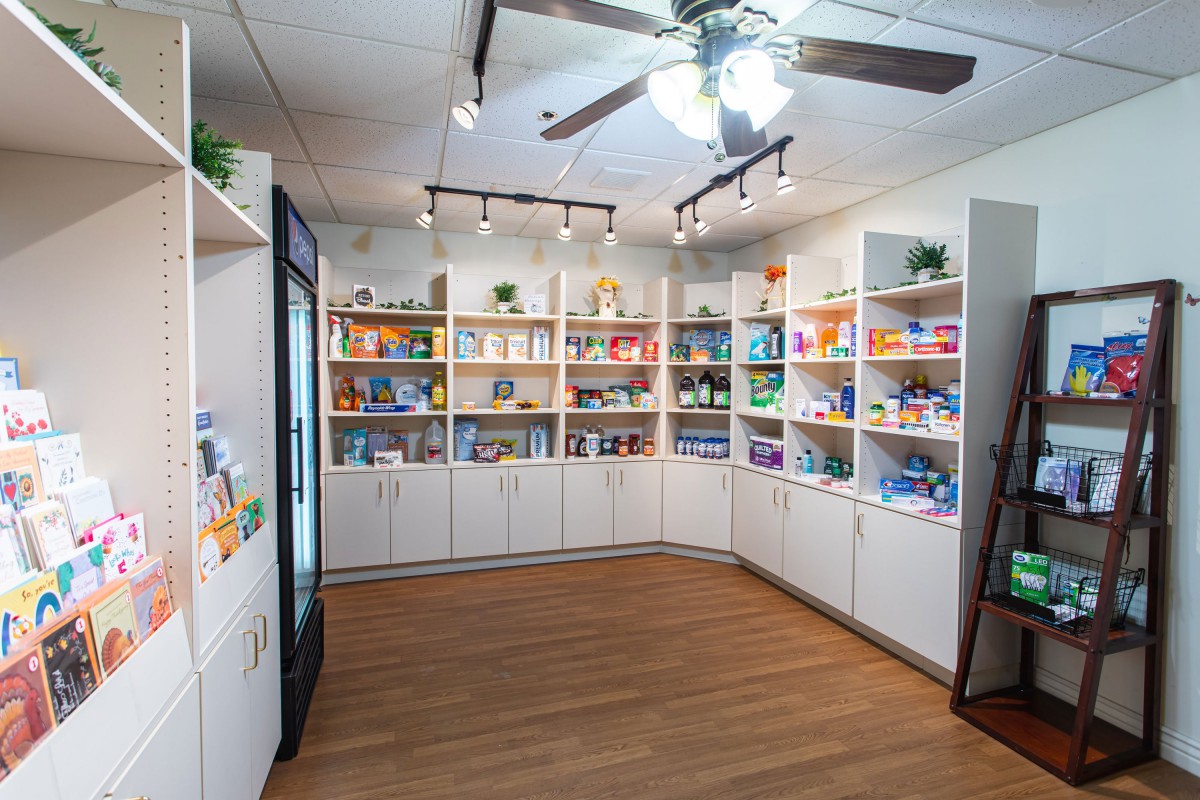 A well-organized pet supply store with shelves stocked full of various products.