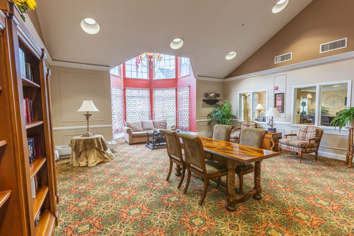 A cozy lobby area with seating and a bright window providing ample natural light.