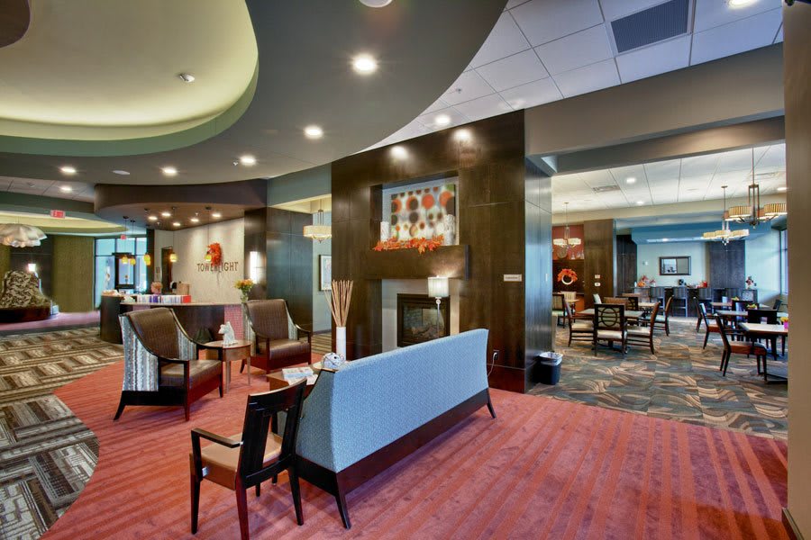 A modern hotel lobby with stylish furnishings and ambient lighting.