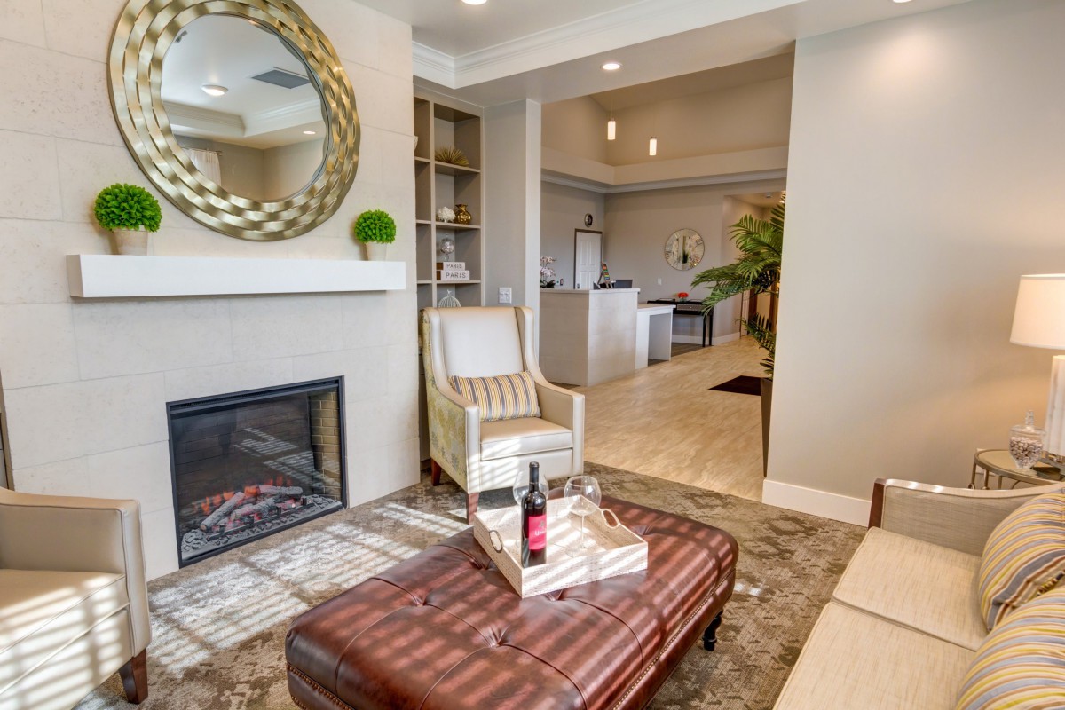 A cozy living room with a fireplace and elegant decor.