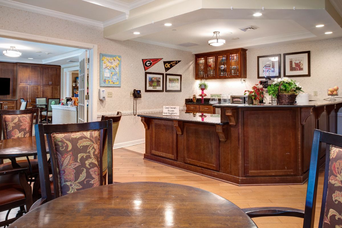 A stylish home bar area with wooden cabinetry and elegant decor.
