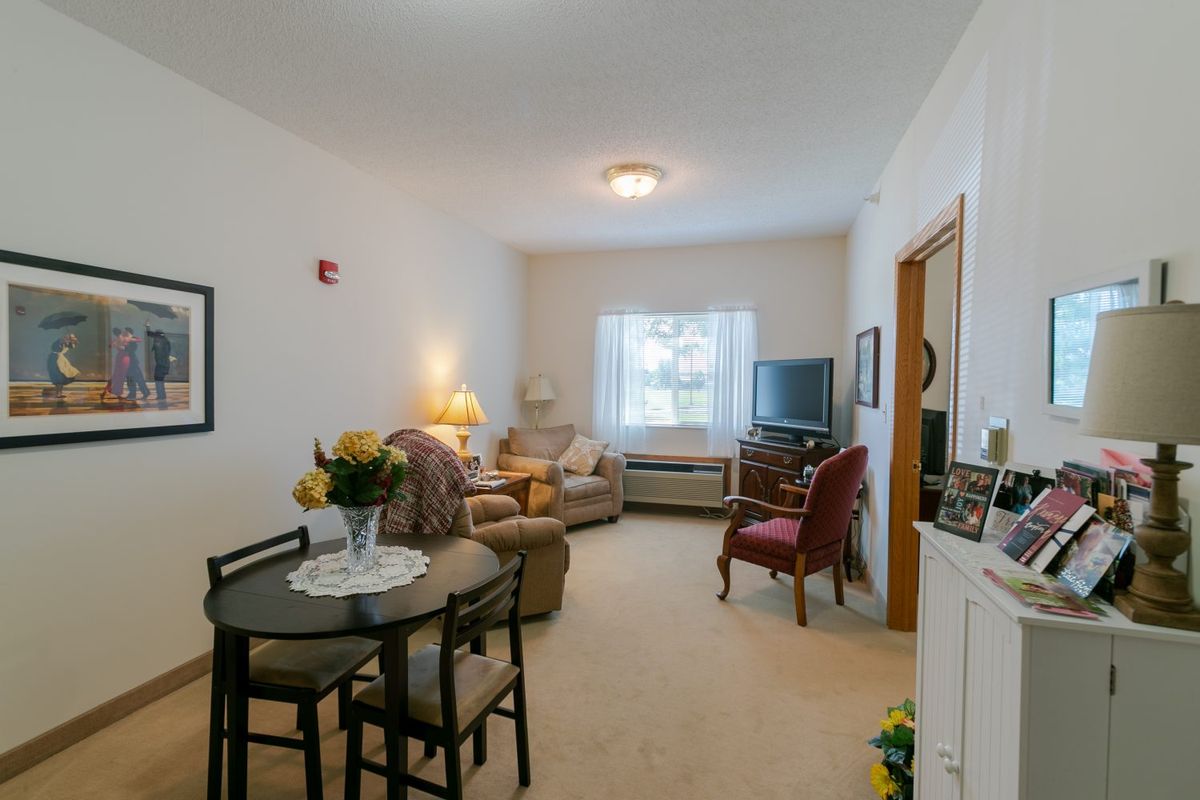 A cozy living room with a dining area and comfortable seating.