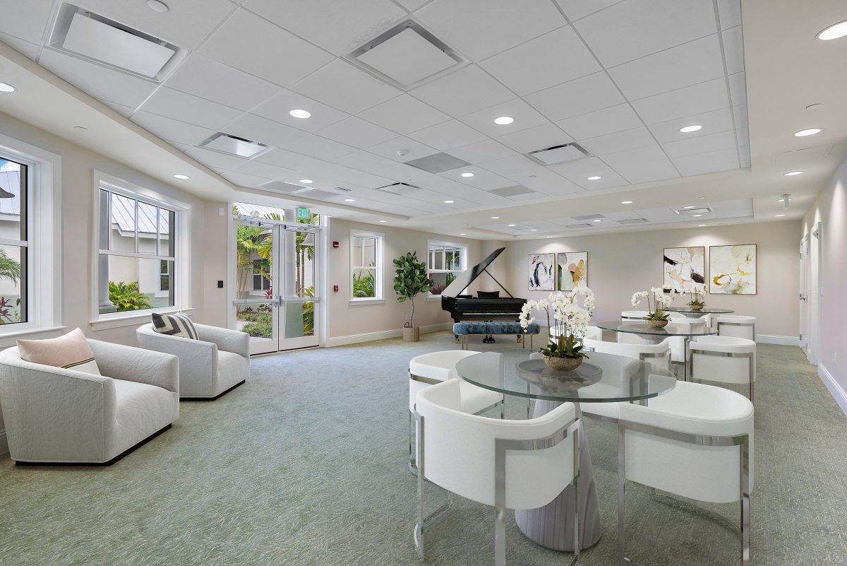 A modern and spacious living room with contemporary furnishings and ample natural light.