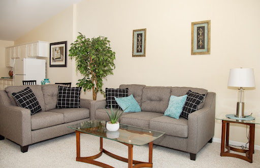 A cozy living room setup featuring comfortable sofas and stylish decor.