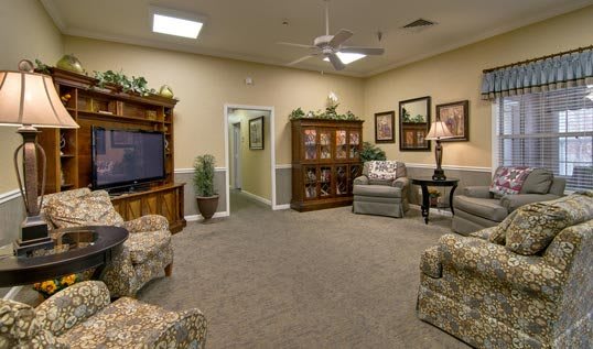 A cozy living room with comfortable seating and a television.