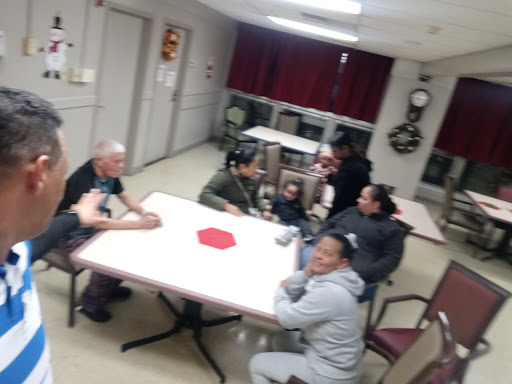 A friendly gathering of individuals around a table.